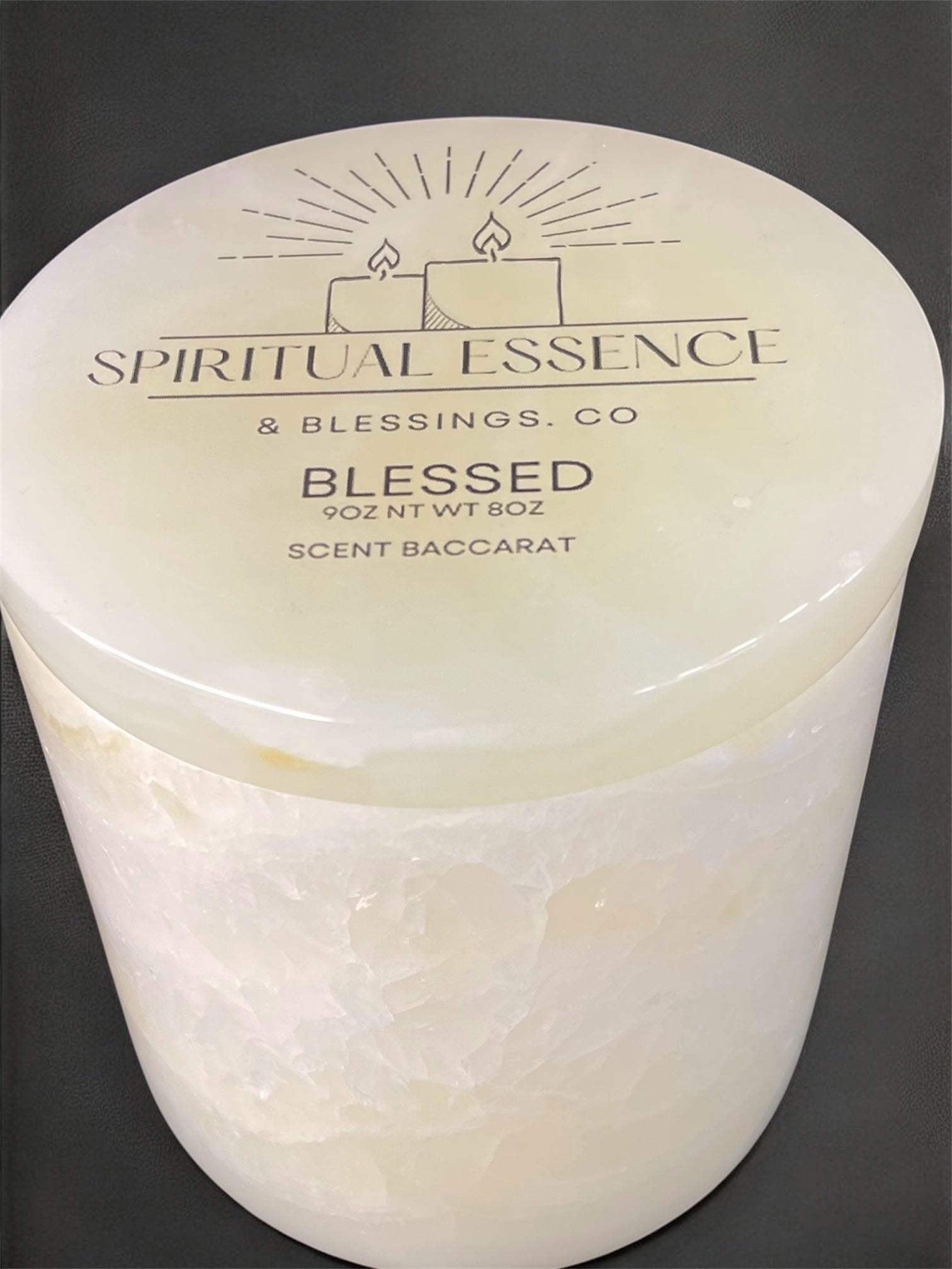 Blessed Baccarat-inspired candle with Spiritual Essence & Blessings Co. logo on marble-style lid.