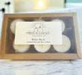 Box of White Birch scented tea light candles with 'Spiritual Essence & Blessings Co' label on a marble surface.