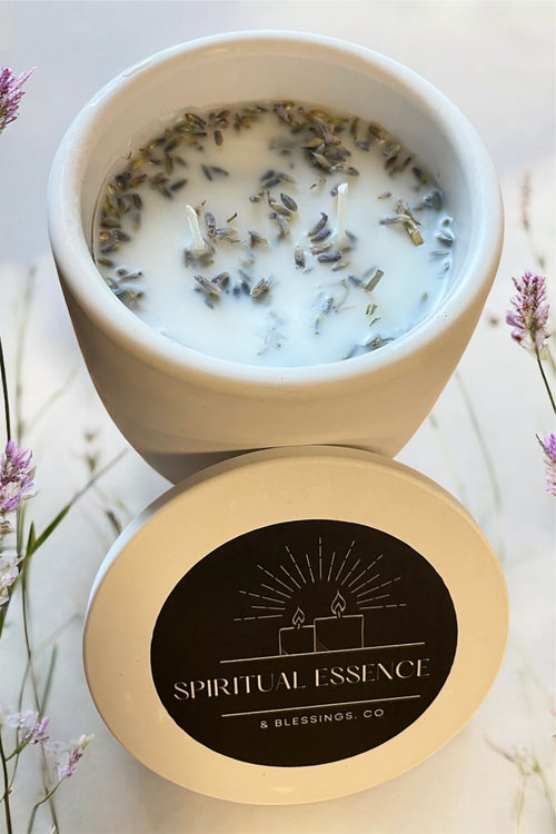 Candle with lavender in a white container, branded 'Spiritual Essence & Blessings Co'.