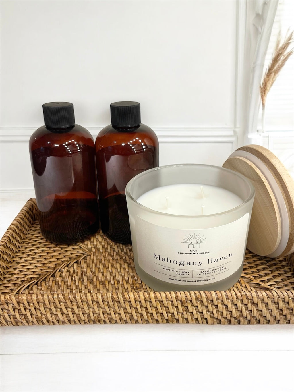 Triple-wick mahogany and cedarwood candle on woven tray — minimalist home decor style