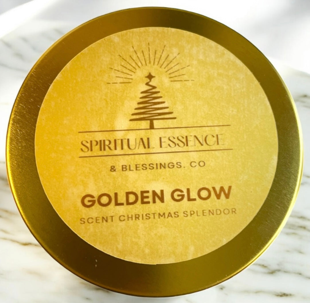 Close-up of Golden Glow candle lid featuring gold logo tree design and brand name Spiritual Essence & Blessings Co. Sophisticated holiday candle packaging.