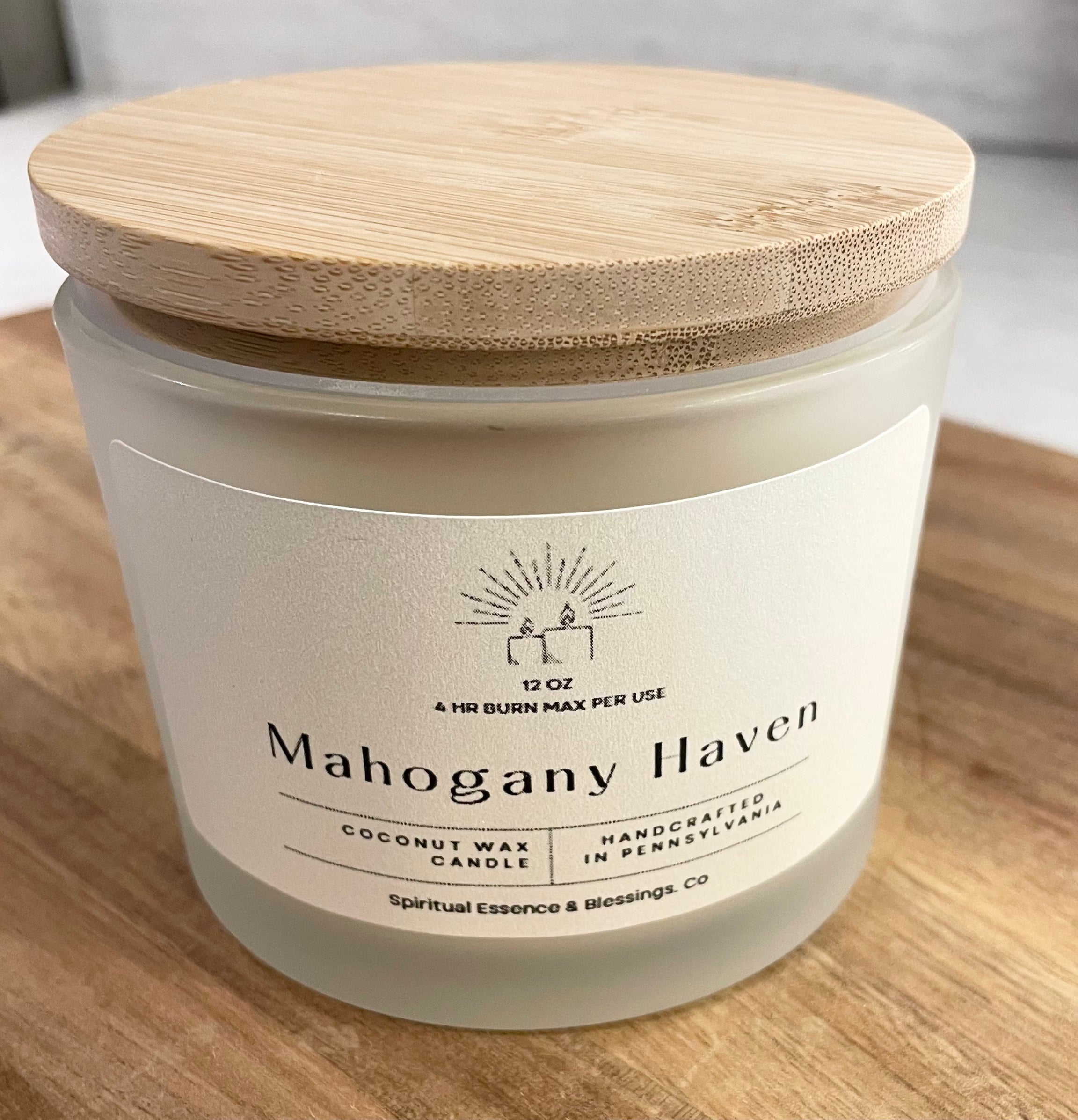 Mahogany Haven woodsy candle with bamboo lid and frosted glass jar — calming home fragrance
