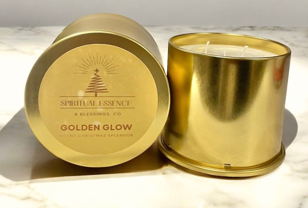 Matching gold candle tins with Golden Glow labels displayed together. Elegant holiday home decor and gift candle by Spiritual Essence & Blessings Co.