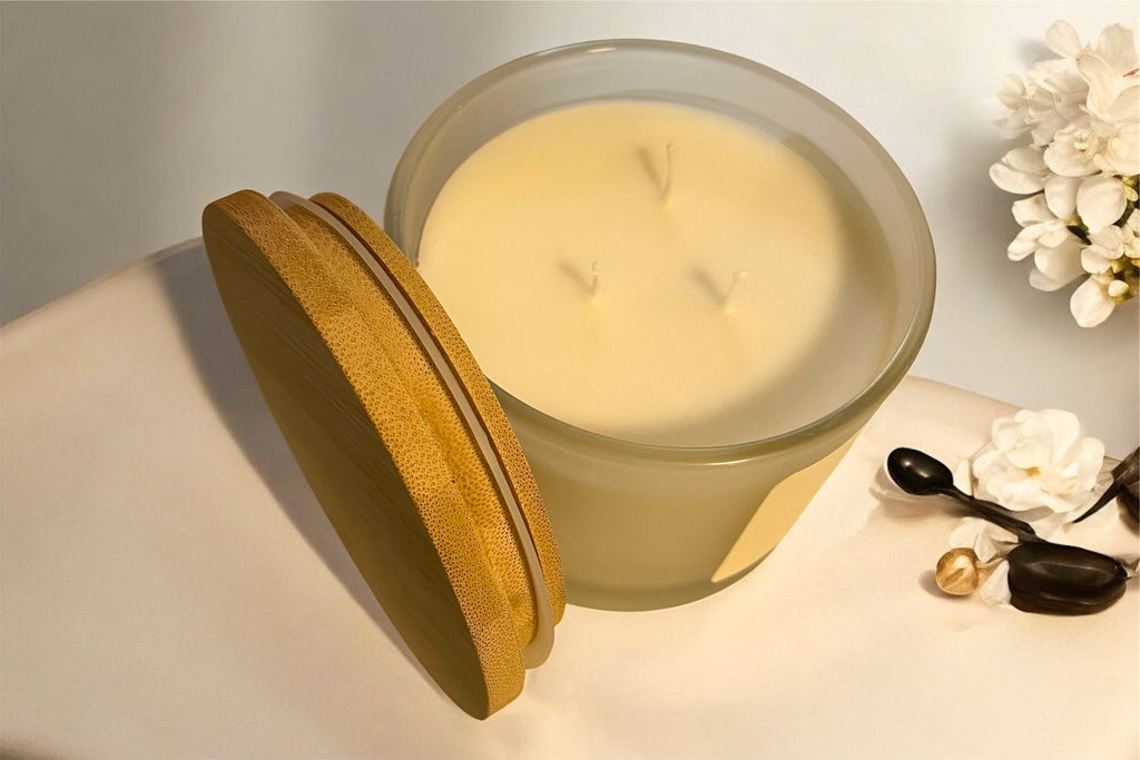 Sacred Verdant candle on modern cream colored table with neutral decor and soft lighting.”