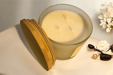Load image into Gallery viewer, Sacred Verdant candle on modern cream colored table with neutral decor and soft lighting.”
